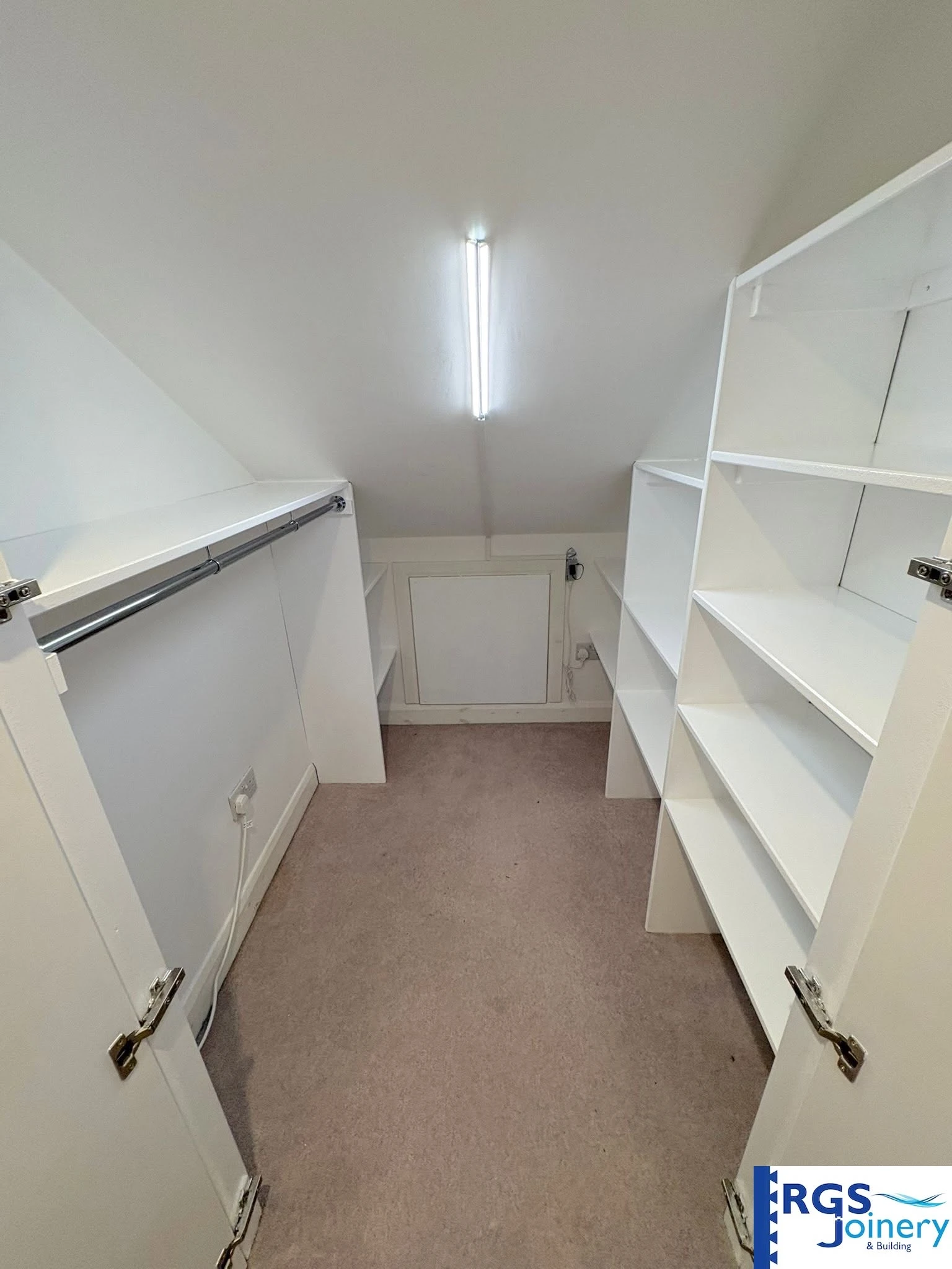 Fitted eaves storage in a loft conversion, built by RGS Joinery and Building