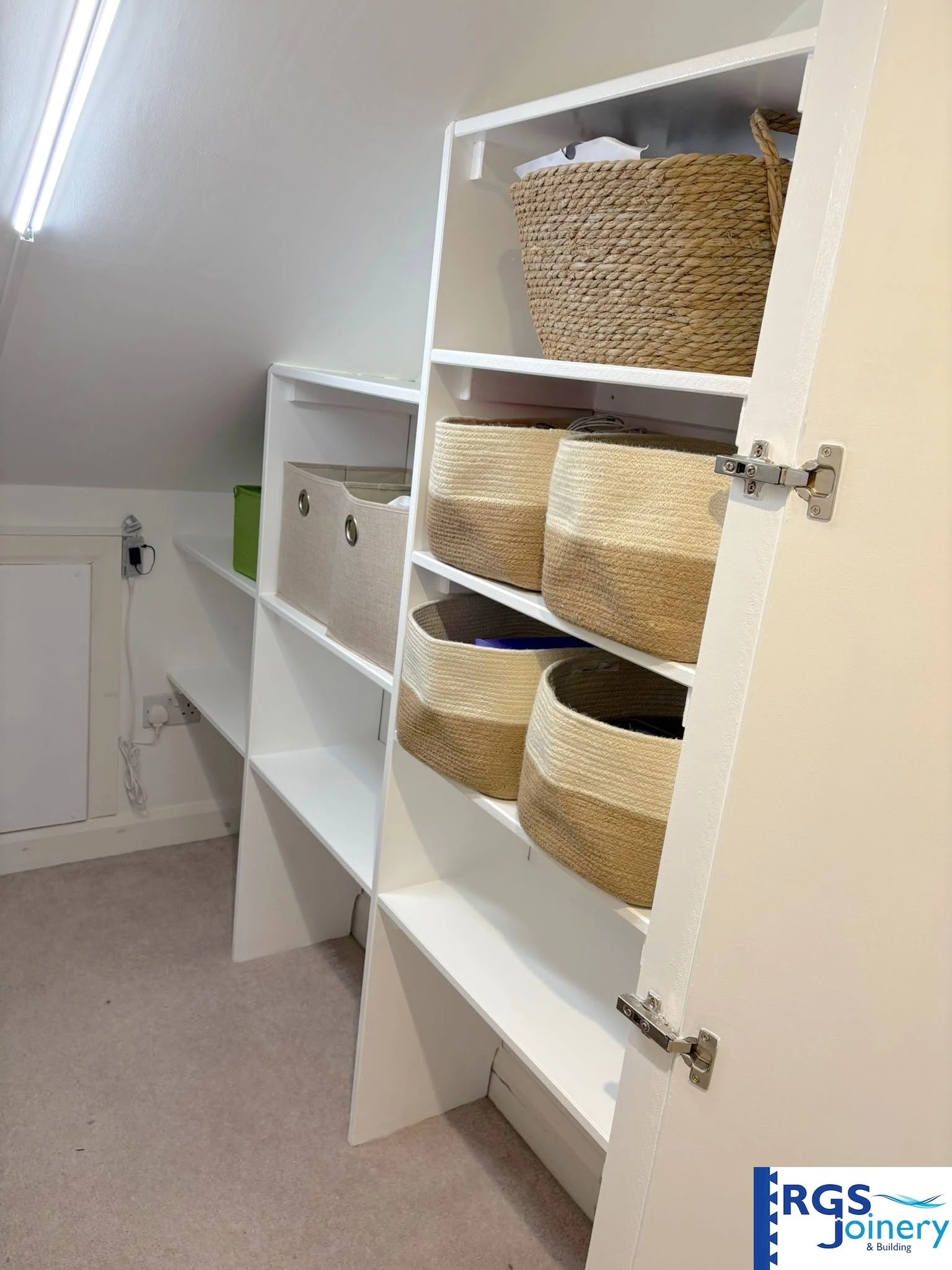 Bespoke eaves shelving detail in a loft conversion, built by RGS Joinery and Building