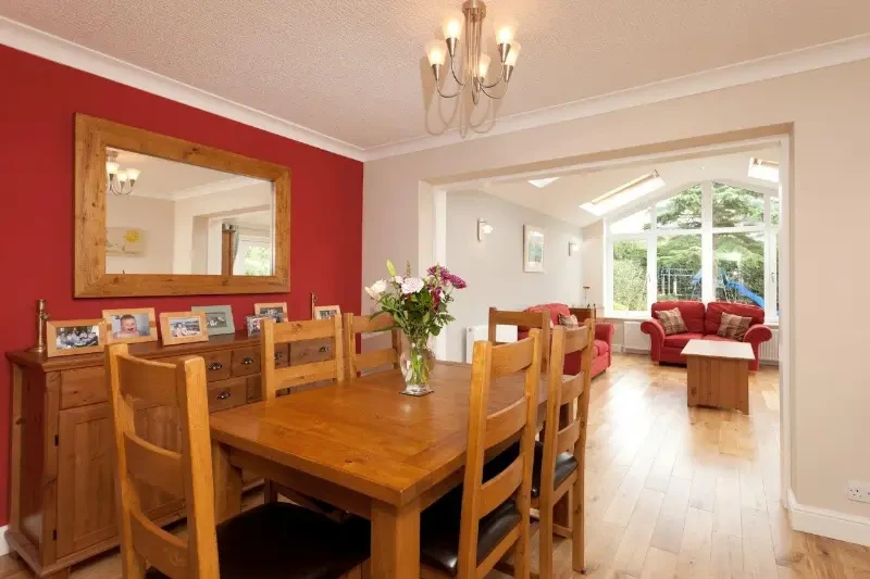 Oak dining area opening into a vaulted gable rear extension, built by RGS Joinery and Building
