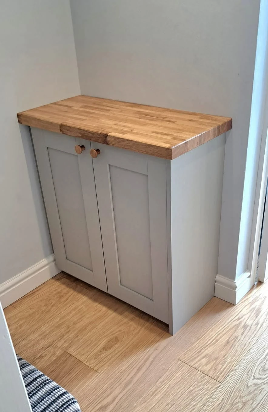 Fitted understair storage joinery by RGS Joinery and Building