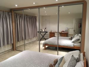 Built in Wardrobe with Sliding Mirrored Doors after